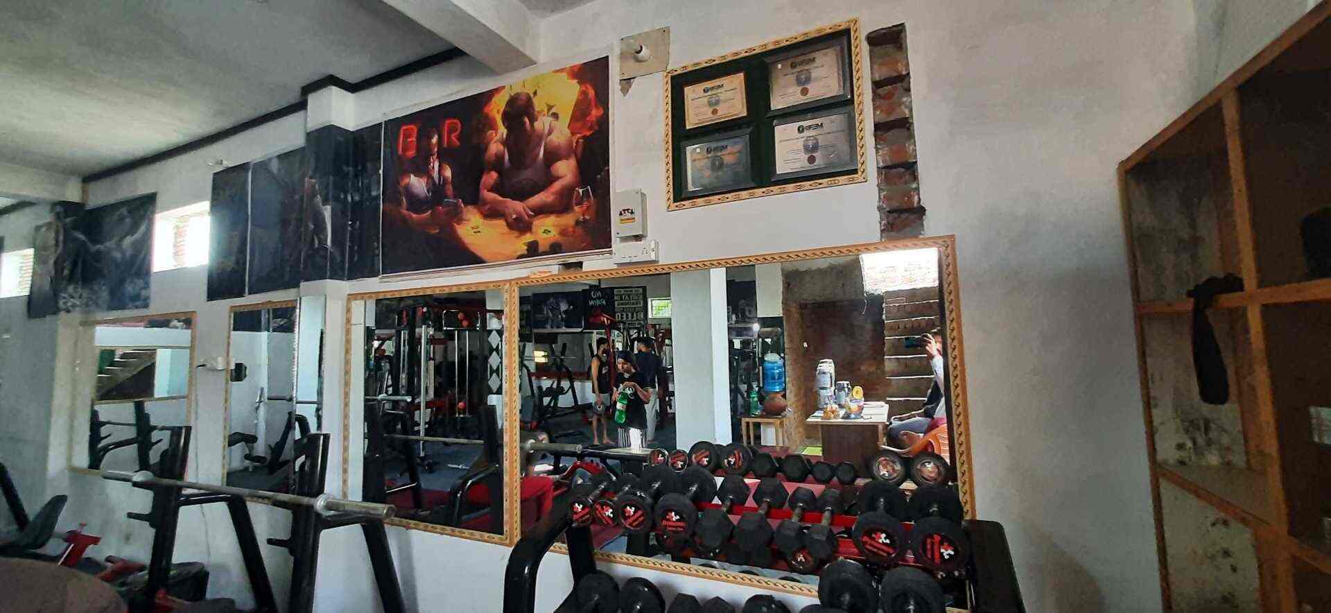 Dynamic Unisex Gym dumbbell station, full mirror bays and trainer certification plaques in Aligarh